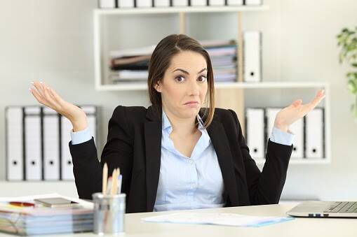 Confused businesswoman trying to make a decision